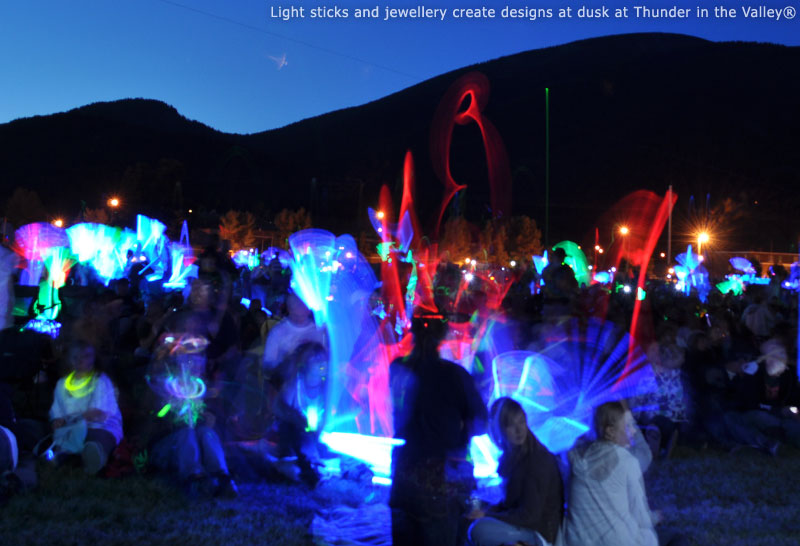 Light sticks and jewellery create designs at dusk at Thunder in the Valley