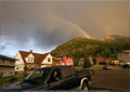 A spring shower brings a double rainbow at the foot of Turtle Mtn.